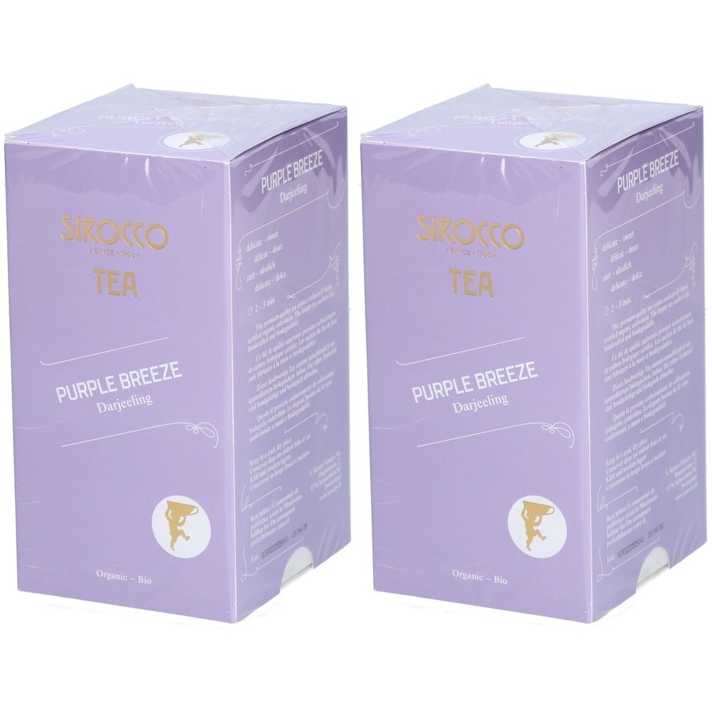 Deux boîtes violettes "Sirocco Tea Purple Breeze Darjeeling". Inscriptions dorées et blanches.