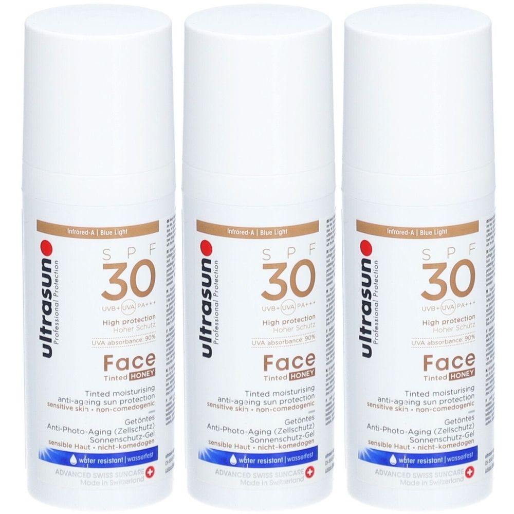 Trois flacons blancs avec étiquettes marron. Inscription : SPF 30, Face, HONEY. Marque : Ultrasun.