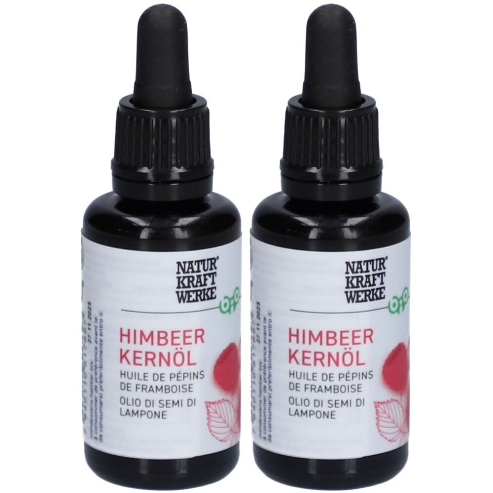 Deux flacons d'huile de pépins de framboise bio. Flacons noirs avec compte-gouttes. Étiquette avec nom du produit et marque NATUR KRAFT WERKE.