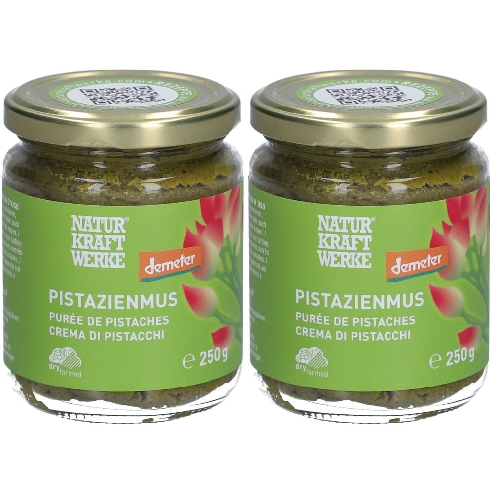 Deux pots de purée de pistaches avec le label Demeter. Inscription : NATUR KRAFT WERKE, PISTAZIENMUS, PURÉE DE PISTACHES, CREMA DI PISTACCHI. Chaque pot contient 250g.
