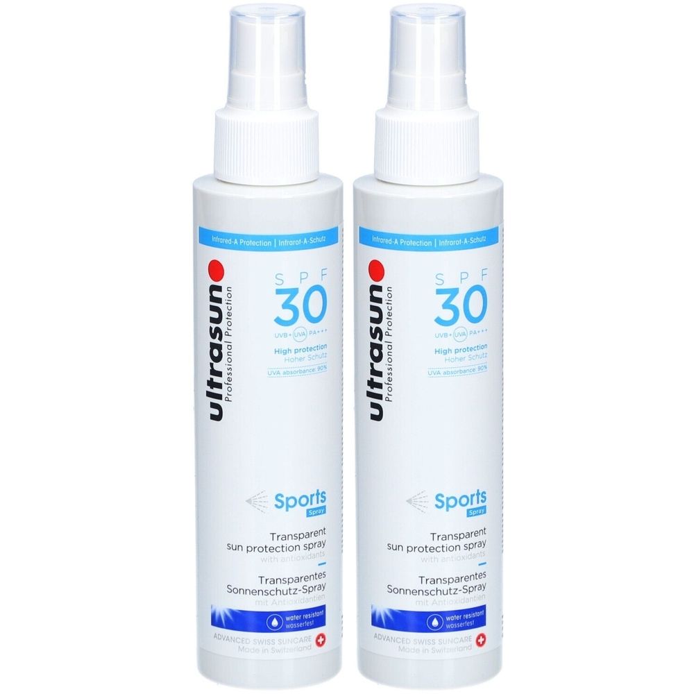 Deux flacons spray blancs avec SPF 30. Inscription: ultrasun, Sports, Transparent sun protection spray.