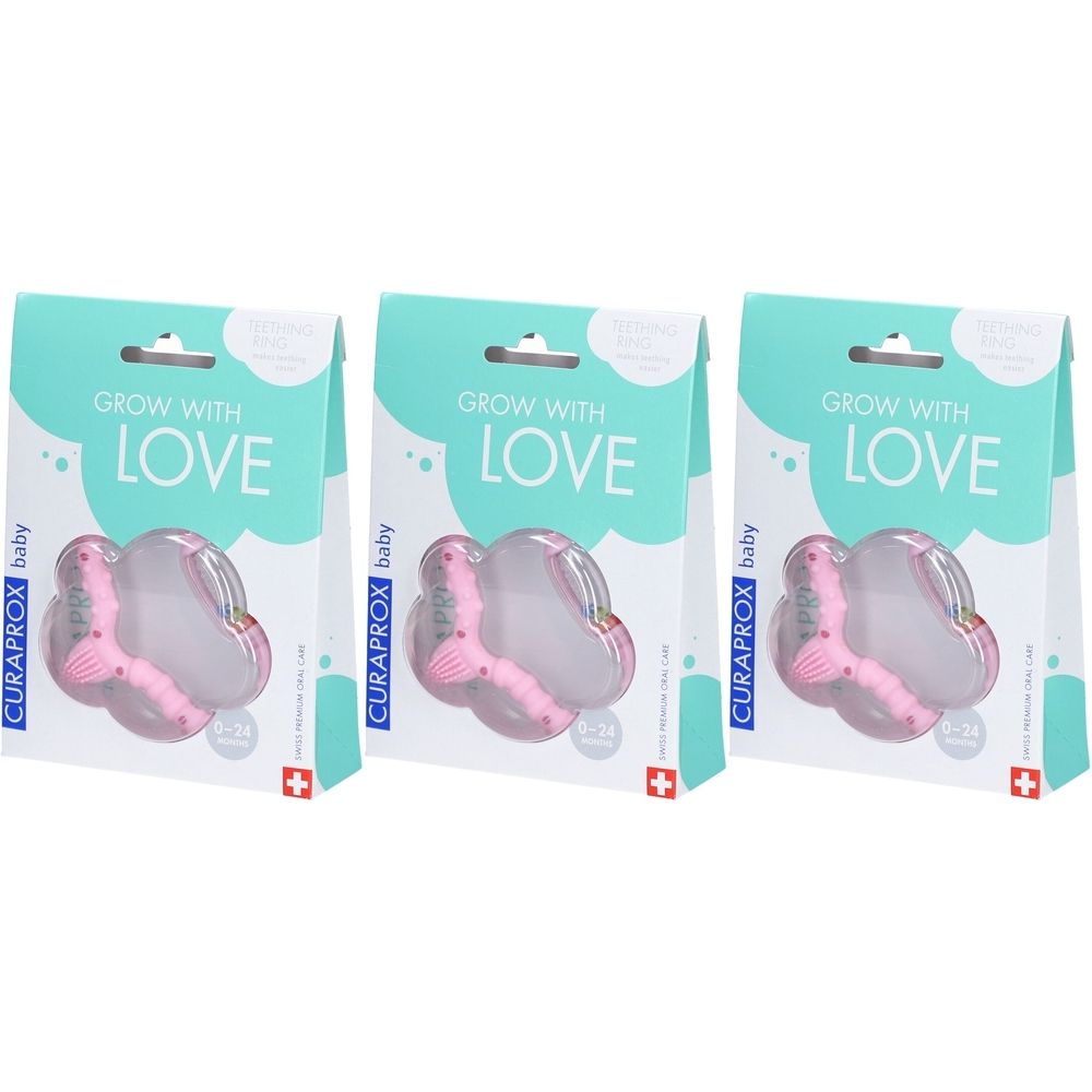 Trois emballages de hochets roses. Inscription : GROW WITH LOVE, CURAPROX baby. Croix suisse.