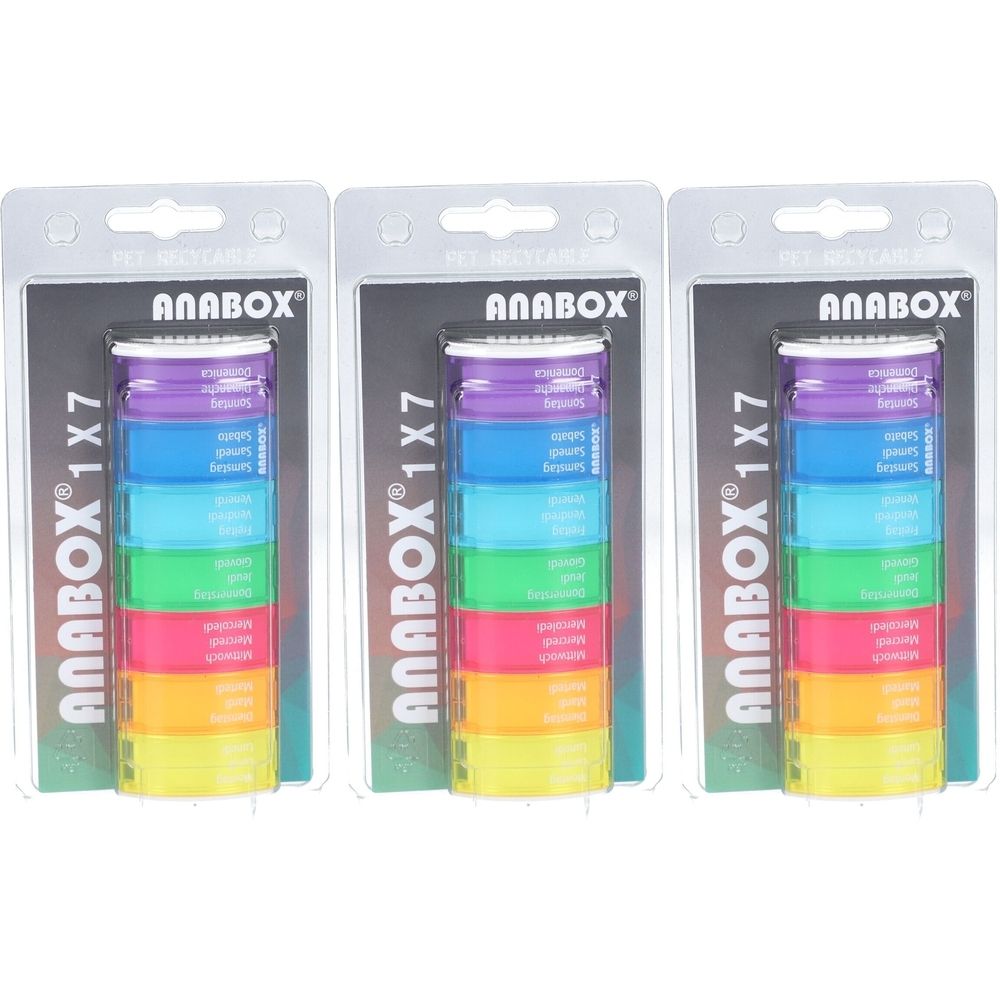Trois boîtes à médicaments Anabox 1x7 colorées. Chaque boîte contient sept compartiments colorés. Emballées sous blister.