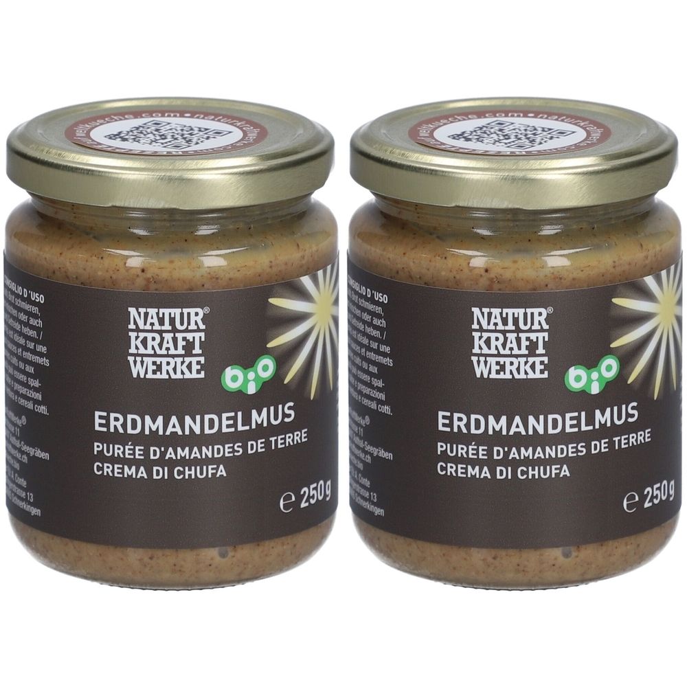 Deux pots de purée d'amandes de terre avec étiquettes marron. Inscription: NATUR KRAFT WERKE, ERDMANDELMUS, PURÉE D'AMANDES DE TERRE, CREMA DI CHUFA. Couvercles dorés.