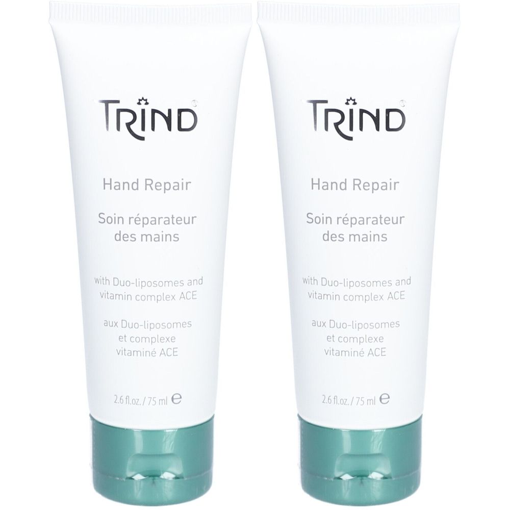 Deux tubes de crème Hand Repair. Tubes blancs avec bouchon vert. Inscription : TRIND, Hand Repair, Soin réparateur des mains.