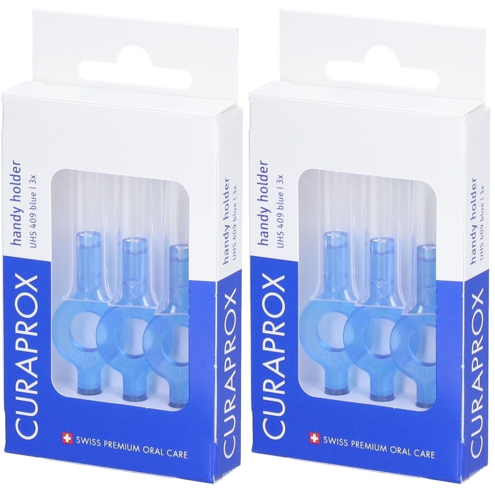 Deux boîtes de supports bleus pour brosses interdentaires. Chaque boîte contient trois brosses. Marque : Curaprox.