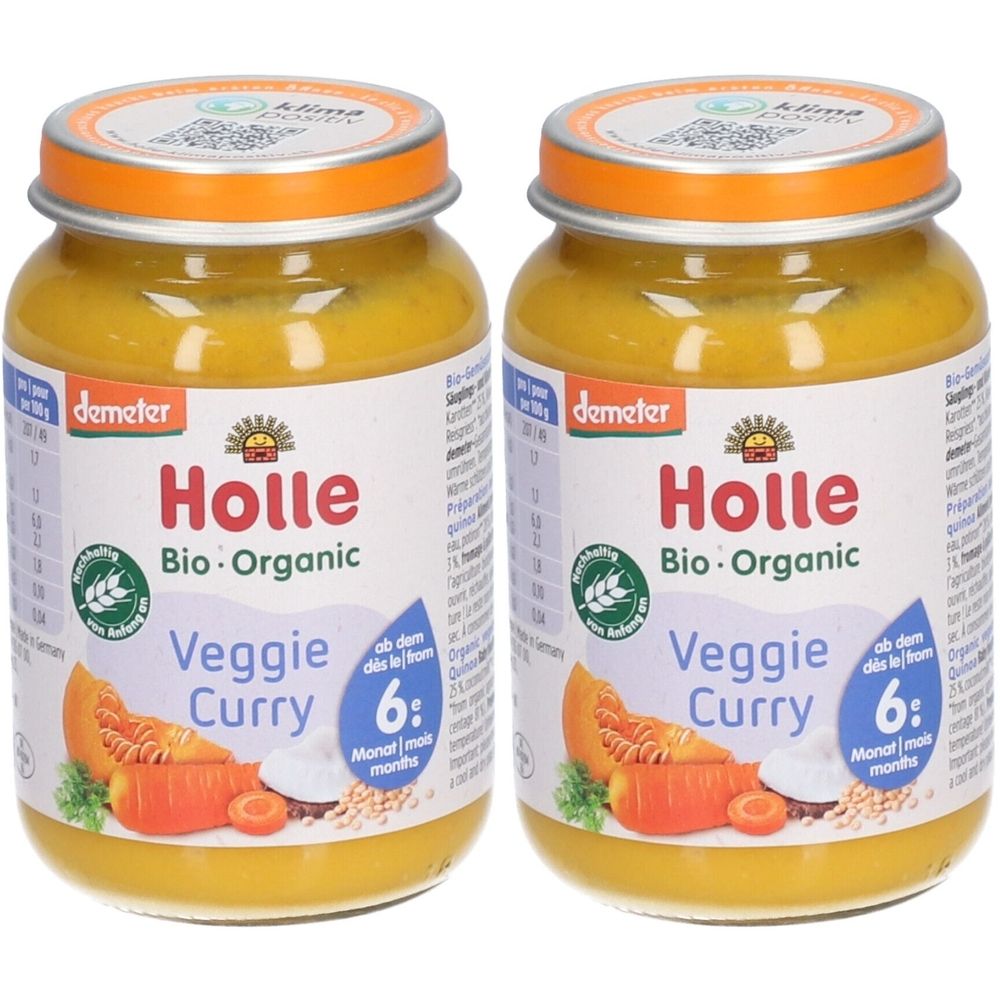 Deux pots de curry de légumes jaunes. Les étiquettes indiquent "Holle Bio-Organic Veggie Curry" et "6+ mois". Label Demeter.