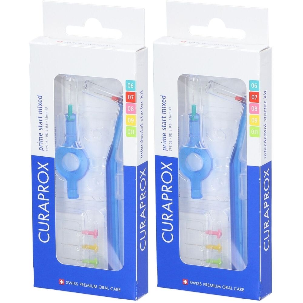Deux boîtes de Curaprox CPS prime start mixed. Brosses à dents bleues avec têtes colorées dans des emballages transparents. Inscription : CURAPROX.