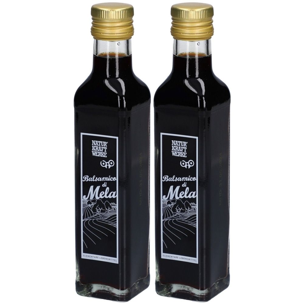 Deux bouteilles de vinaigre balsamique. Verre noir, bouchon doré. Étiquette avec logo et inscription "Balsamico di Mela".