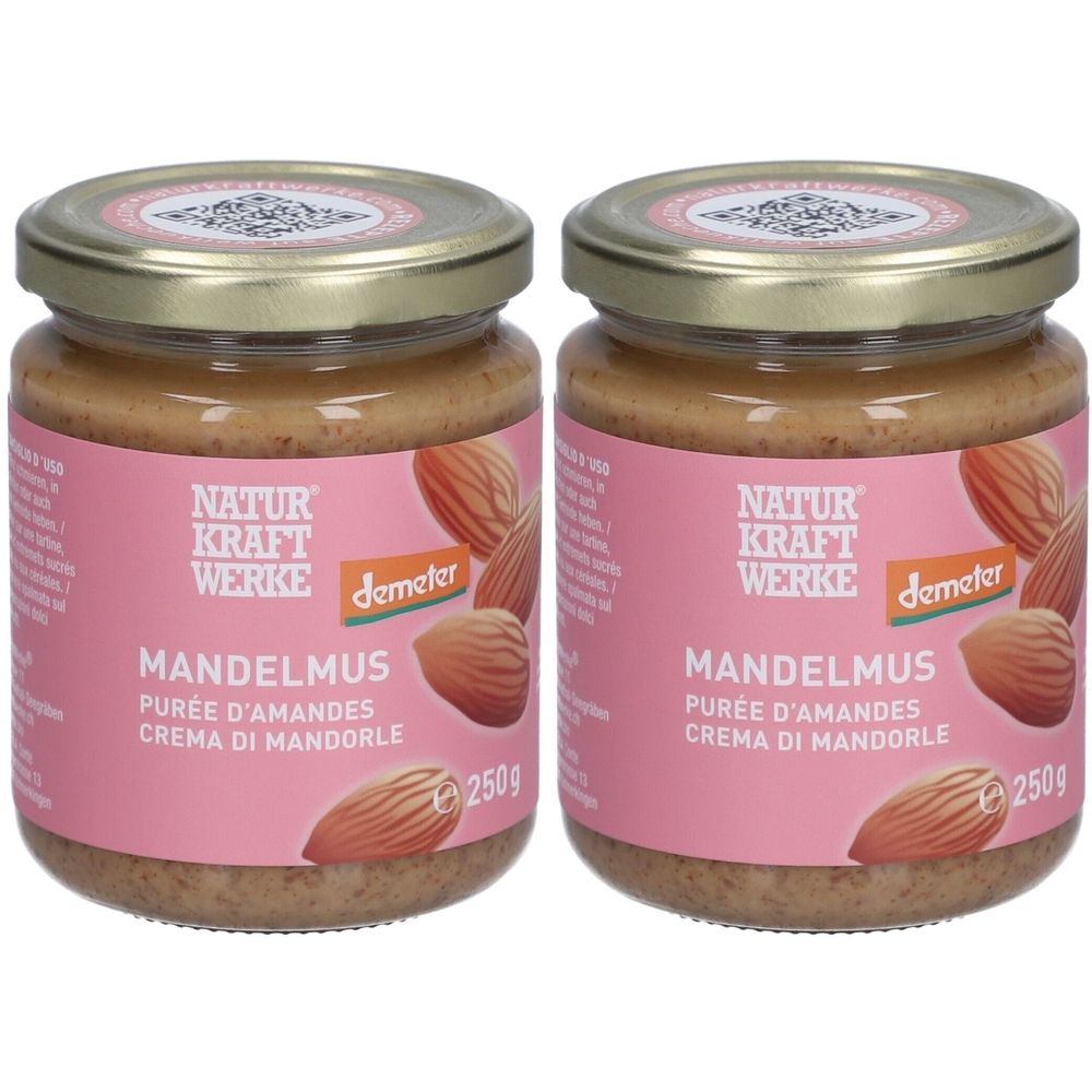 Deux pots de purée d'amandes avec couvercles dorés. Étiquette rose avec nom du produit, marque et label Demeter. 250g.