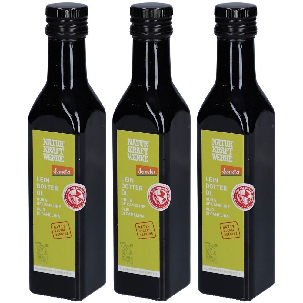 Trois bouteilles en verre noir avec bouchon noir. Étiquette avec texte et label Demeter. Huile de cameline.