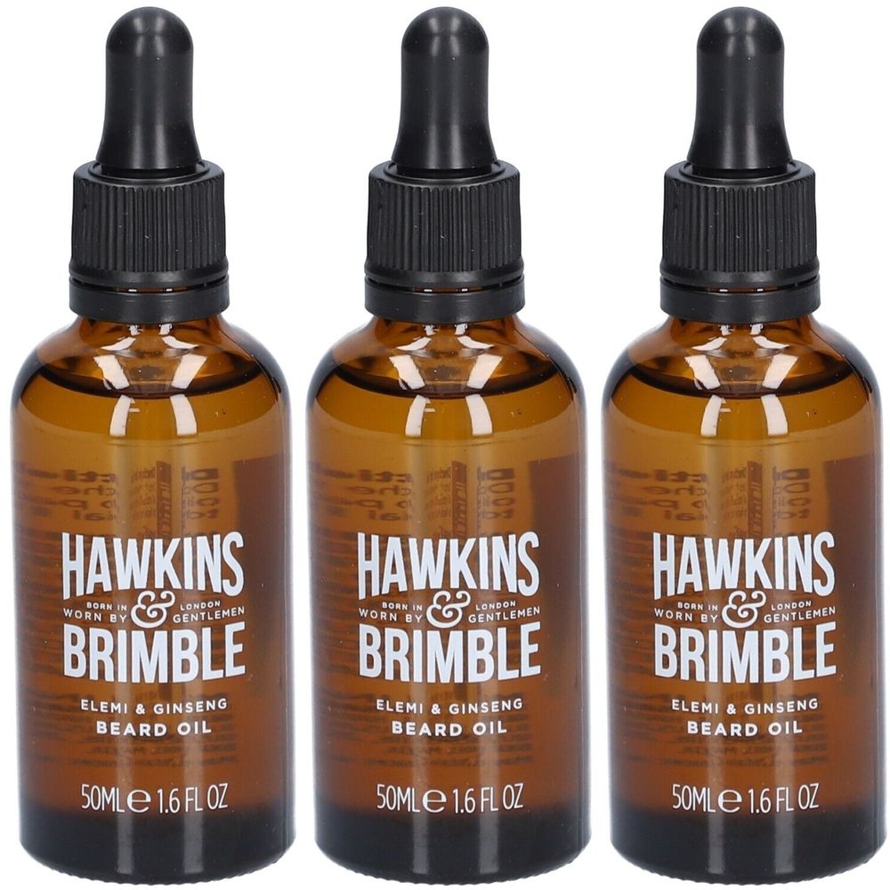 Trois flacons en verre brun avec des compte-gouttes noirs. Chaque flacon porte la marque "Hawkins & Brimble" et "Beard Oil".