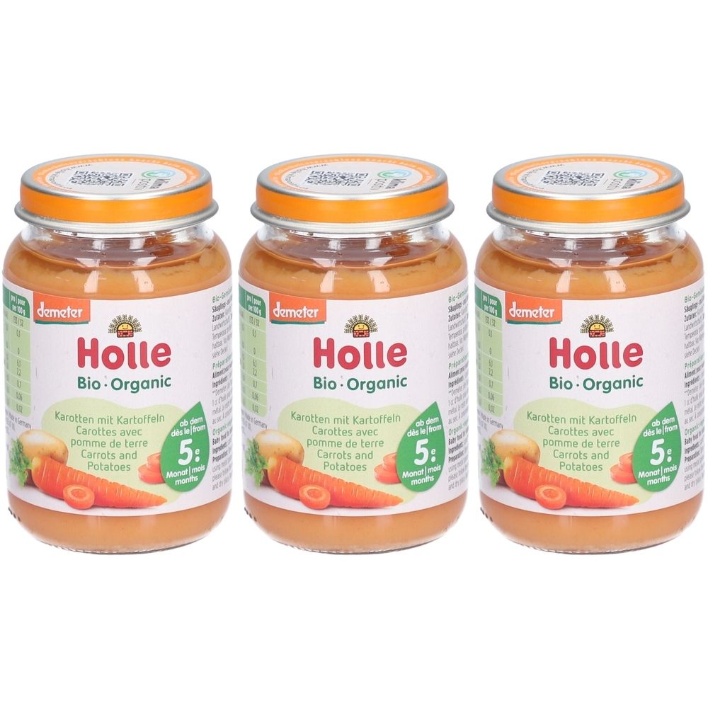 Trois pots de purée pour bébé Holle Bio-Organic. Pots avec couvercles, étiquettes avec informations produit et illustration de carottes. Label Demeter.