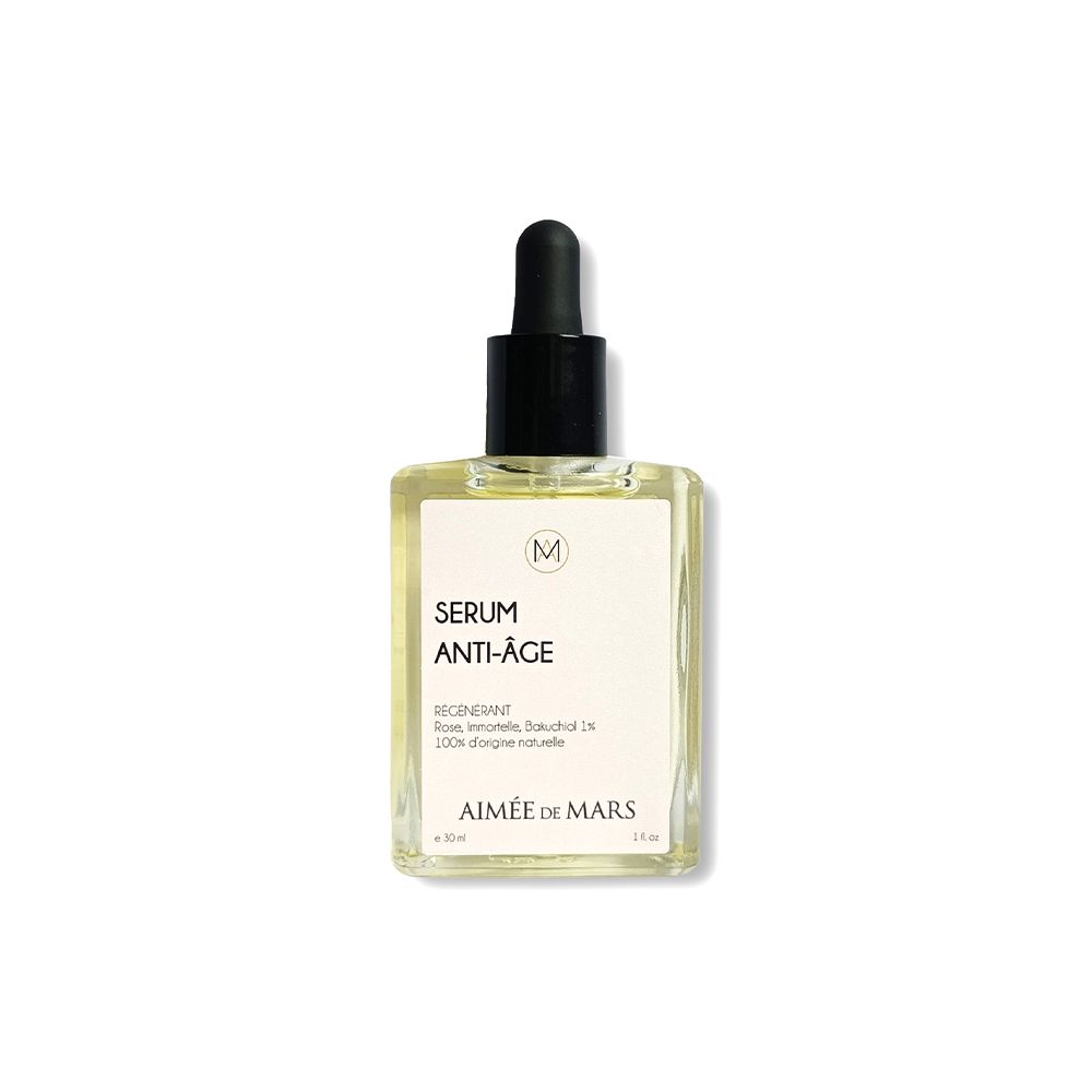 Flacon en verre transparent avec pipette noire. Étiquette "SERUM ANTI-ÂGE" et "AIMÉE DE MARS".