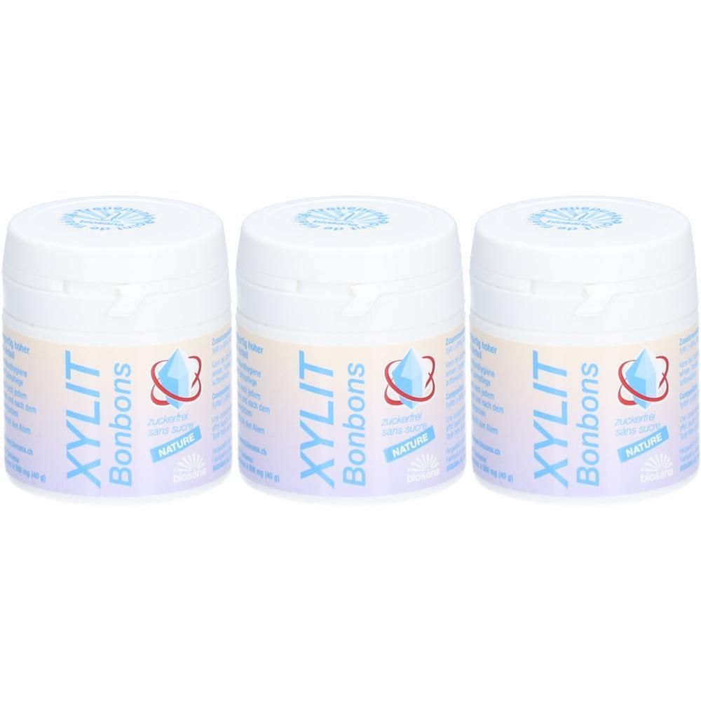 Trois pots de pastilles Biosana Xylit Nature, blancs avec inscription bleue et logo.