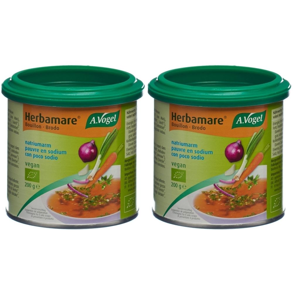 Deux boîtes de bouillon Herbamare. Couvercles verts, étiquette avec illustration de légumes et texte. Label vegan.