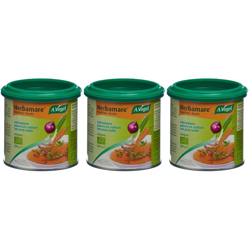 Trois boîtes de bouillon Herbamare. Couvercles verts, étiquette avec illustration de légumes. Vegan, certification bio.
