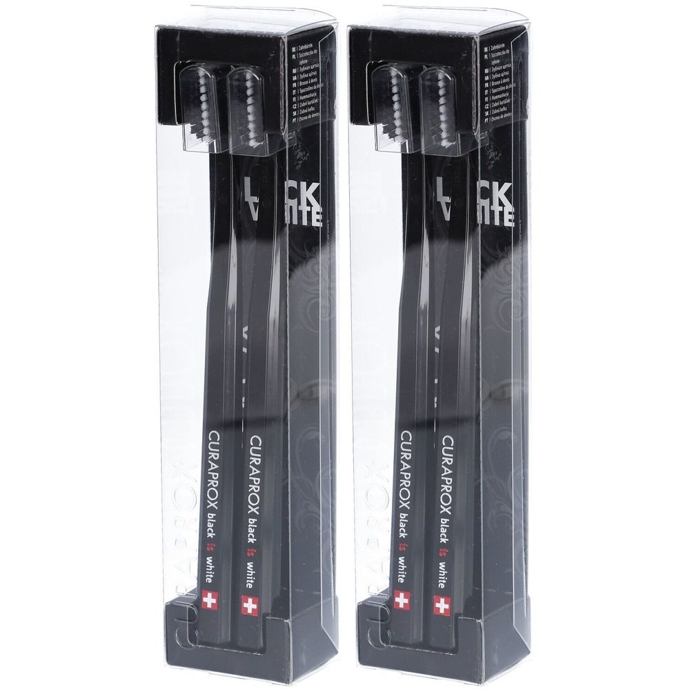 Deux brosses à dents noires dans un emballage transparent. Inscription : CURAPROX black white.