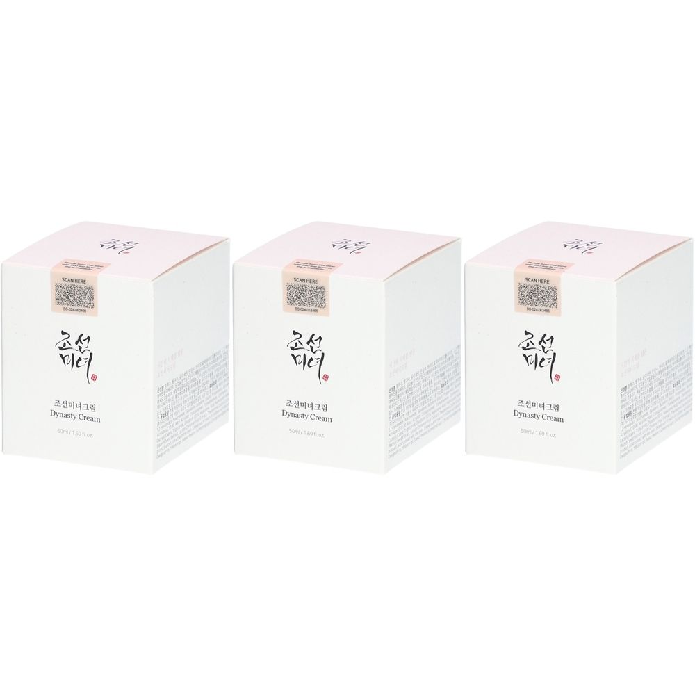 Trois boîtes carrées blanches. Chaque boîte présente des caractères et l'inscription "Dynasty Cream".