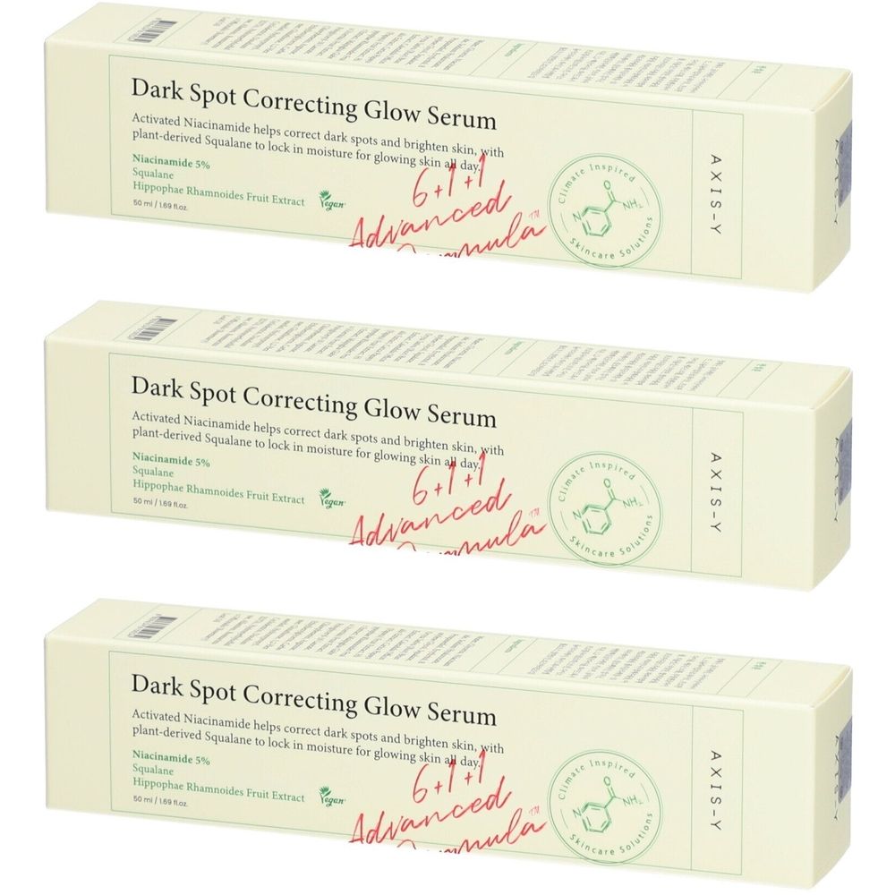 Trois boîtes de "Dark Spot Correcting Glow Serum". Texte: AXIS-Y, 6+1+1 Advanced Formula.