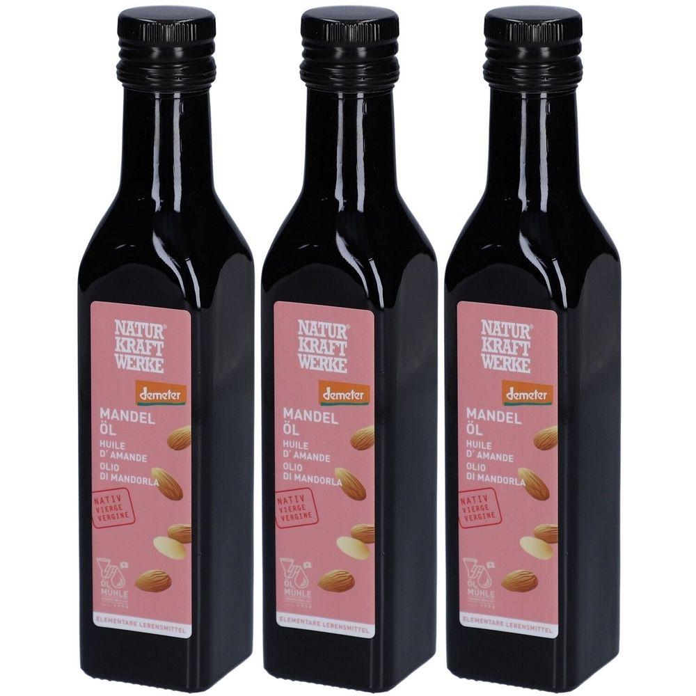 Trois bouteilles d'huile d'amande avec étiquette. Inscription : NATUR KRAFT WERKE, Demeter, Huile d'amande, native, label bio.