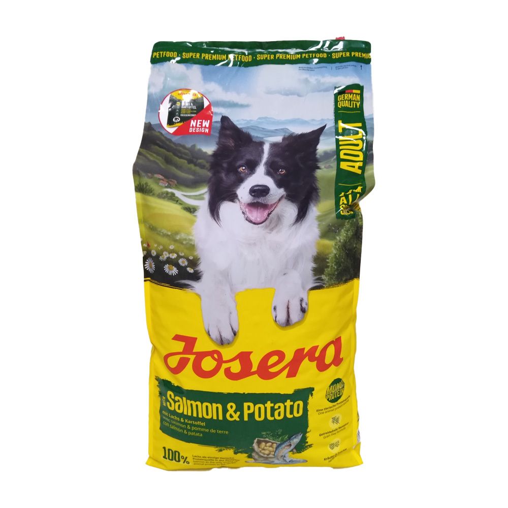Sac jaune avec chien. Inscription "JOSERA Salmon & Potato". Détails vert et jaune. "ADULT" et "100%" visibles.