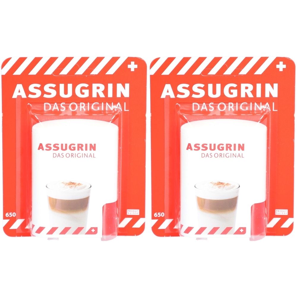 Deux emballages ASSUGRIN Das Original. Emballage rouge avec texte blanc et image de boisson. 650 comprimés.