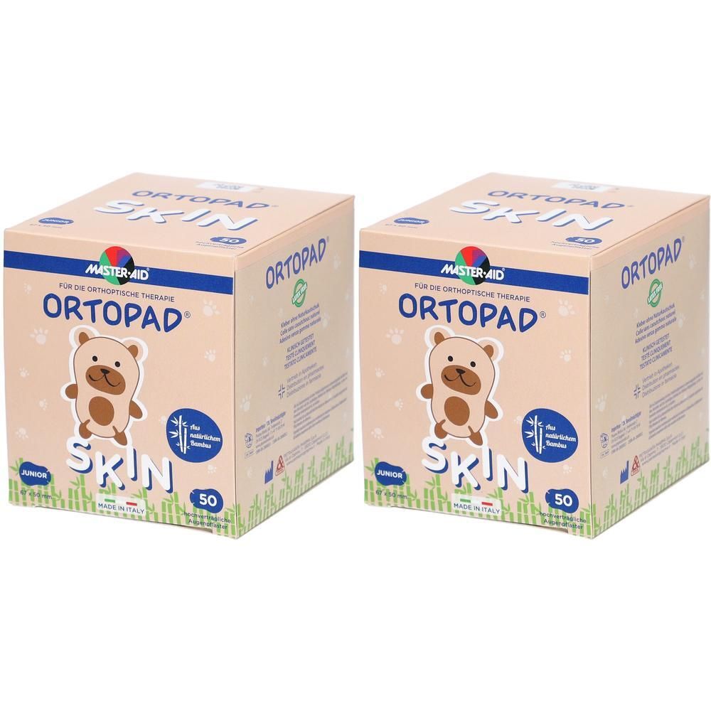 Deux paquets de pansements oculaires Ortopad Junior Skin, 50 pièces chacun. Boîte en carton avec motif d'ours.