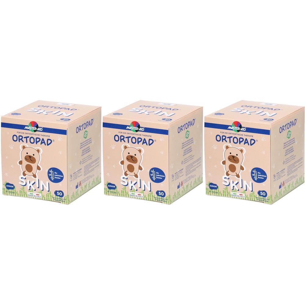 Trois paquets de pansements oculaires Ortopad Junior Skin, chacun contenant 50 pièces. L'emballage présente un ours et est destiné aux enfants.