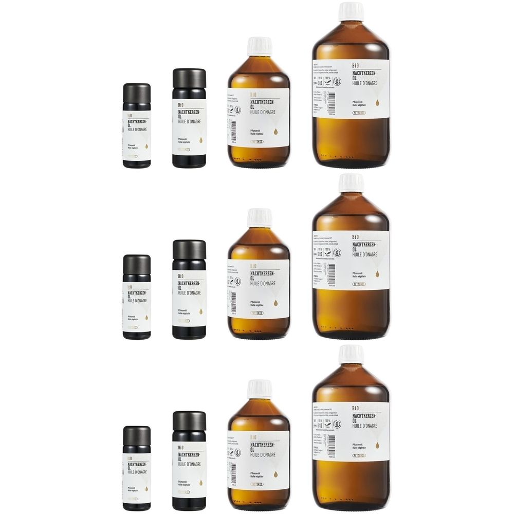 Plusieurs bouteilles et petits flacons. Inscription : Huile d'onagre bio. Bouteilles en verre brun avec étiquettes blanches et bouchons noirs.