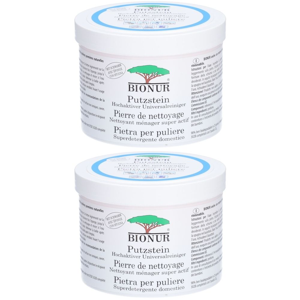 Deux boîtes blanches avec couvercles bleus. Inscription: BIONUR Putzstein. Désignations multilingues du produit.