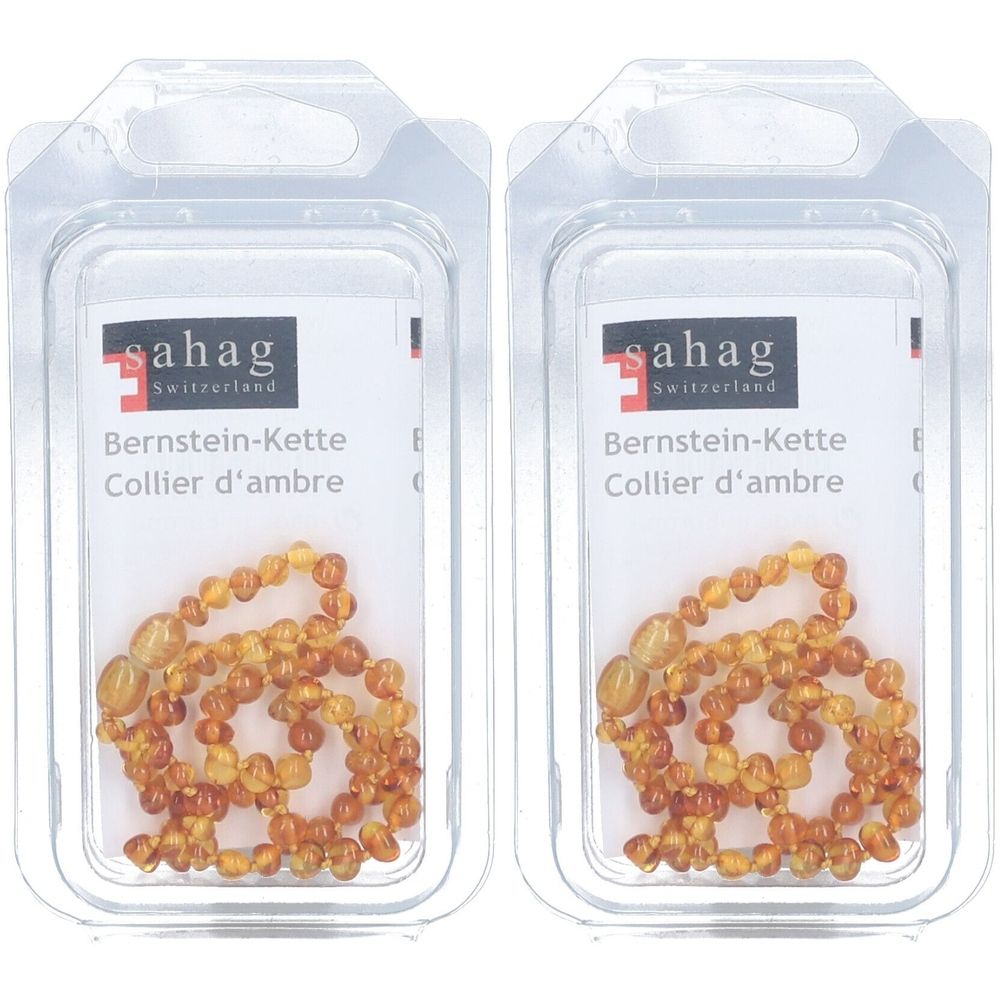 Deux colliers pour bébé en ambre naturel dans un emballage transparent. Inscription: sahag, Bernstein-Kette, Collier d'ambre.
