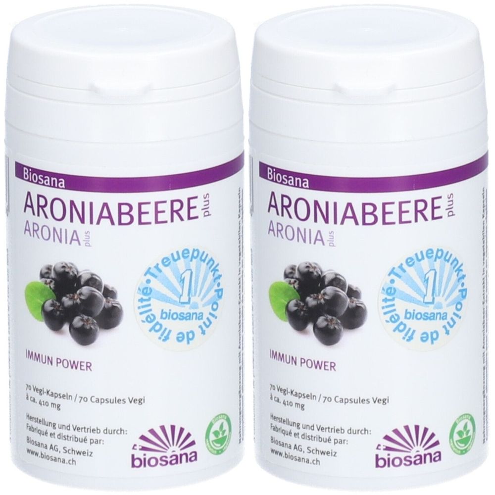 Deux boîtes blanches avec des étiquettes violettes et vertes. Inscription : Aroniabeere plus, Aronia, Immun Power. Logo : biosana.