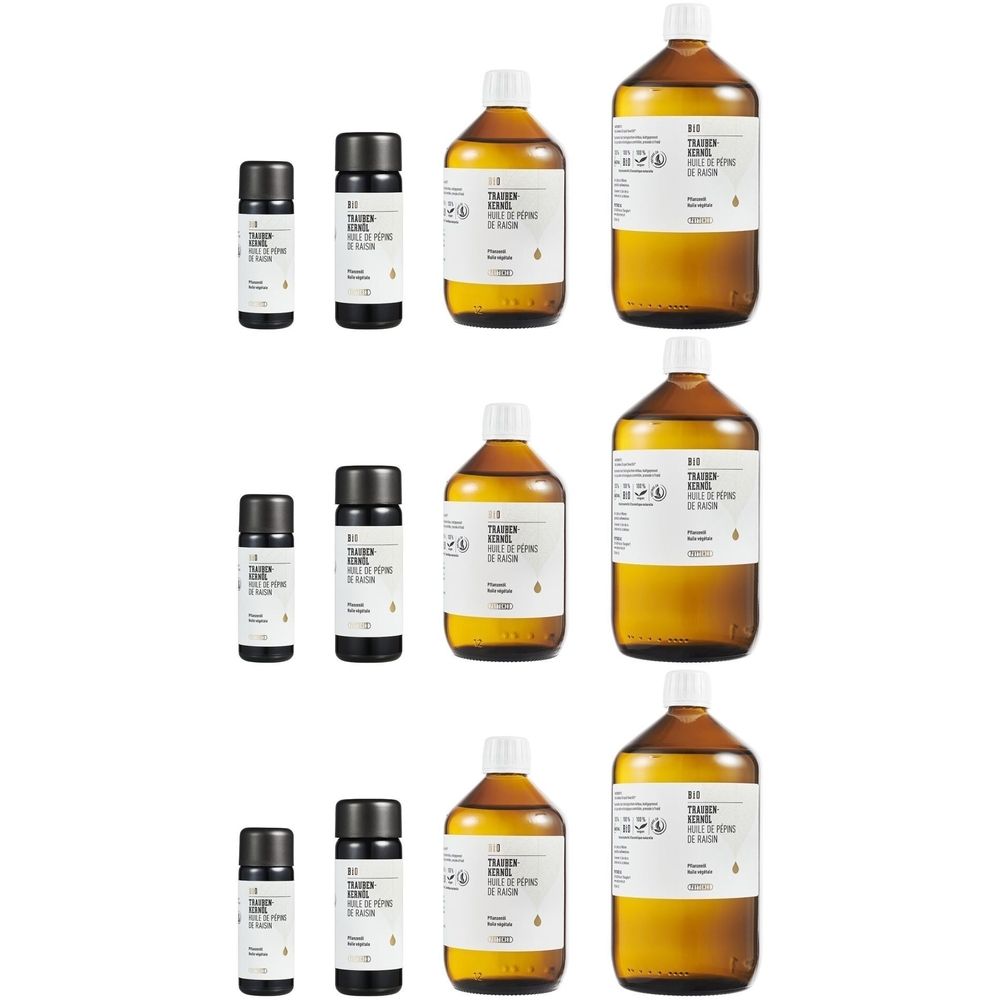 Plusieurs bouteilles et petits flacons. Bouteilles en verre brun avec étiquettes blanches et bouchons noirs. Petits flacons avec bouchons noirs.