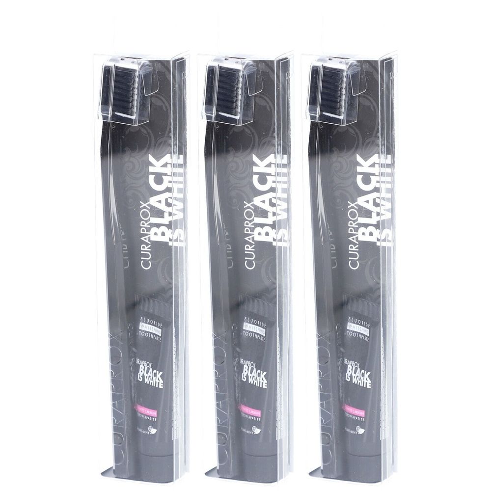 Trois brosses à dents emballées. Inscription: CURAPROX BLACK IS WHITE.
