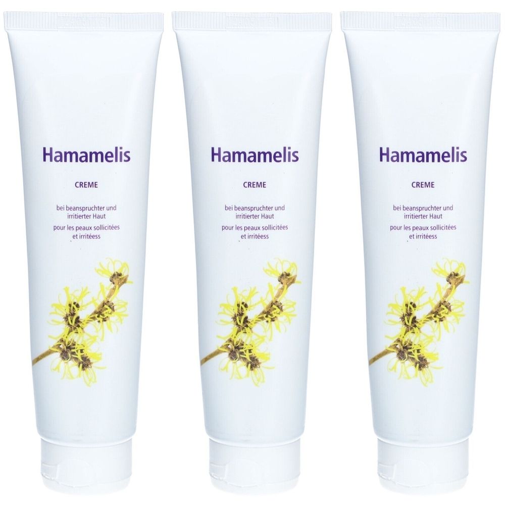 Trois tubes blancs avec impression Hamamelis Crème. Texte en allemand et français. Illustration de fleurs jaunes.