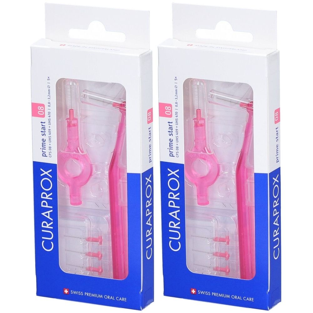 Deux boîtes de brosses interdentaires. Brosses et supports roses dans des emballages en plastique transparents. Marque : CURAPROX.