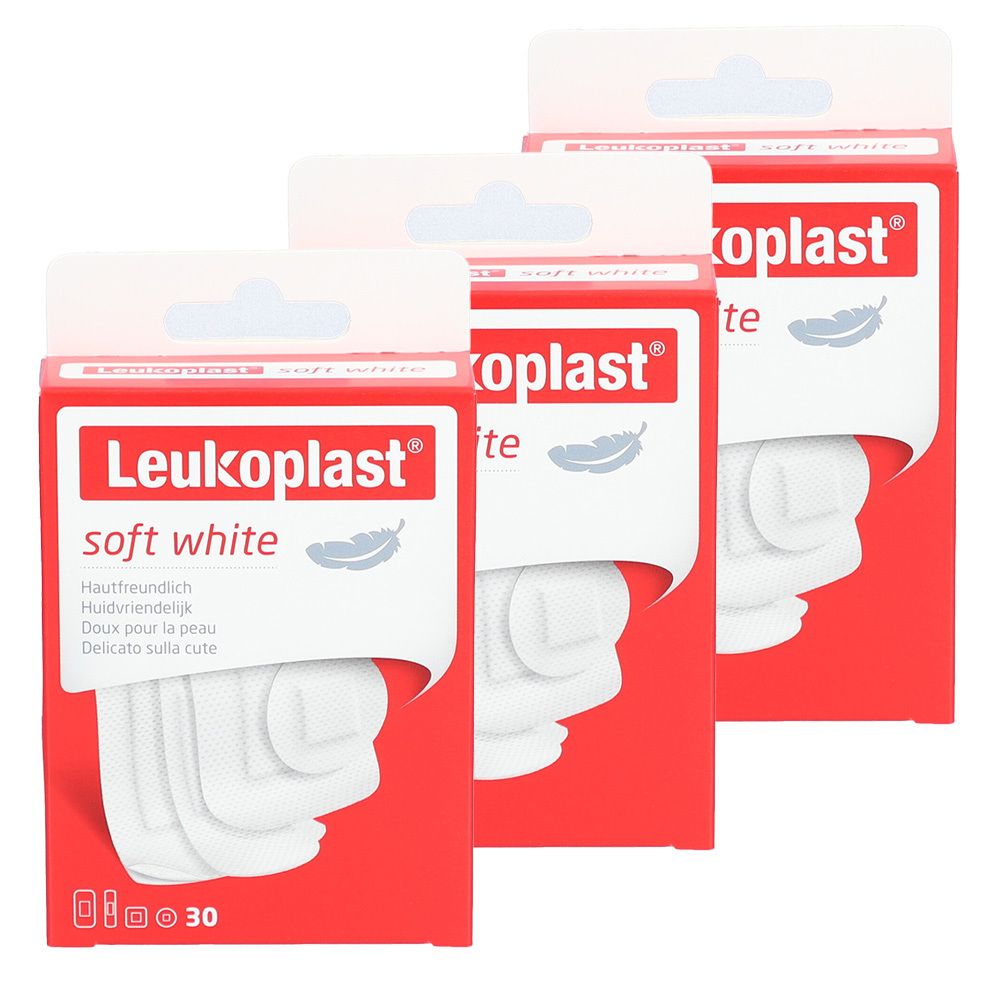 Trois boîtes de Leukoplast Soft Strips. Emballage rouge avec produit blanc. Inscription : soft white. 30 pièces.