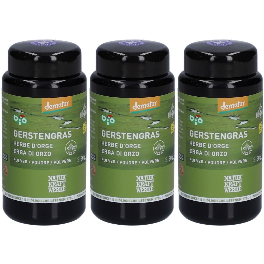 Trois boîtes noires avec couvercles. Inscription : Gerstengras, Herbe d'orge, Erba di orzo, Pulver/Poudre/Polvere. Logo Demeter.
