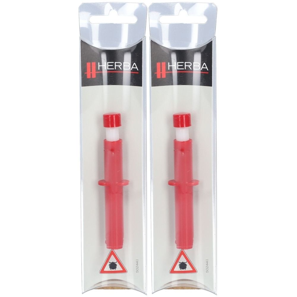 Deux pinces à tiques rouges en plastique, emballées sous blister. Partie centrale blanche, capuchon rouge. Marque HERBA.