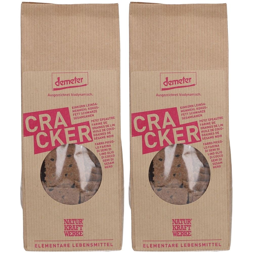 Deux paquets de crackers en sachets en papier brun. Fenêtre transparente montrant les crackers. Logo Demeter et texte "Cracker" en rose.