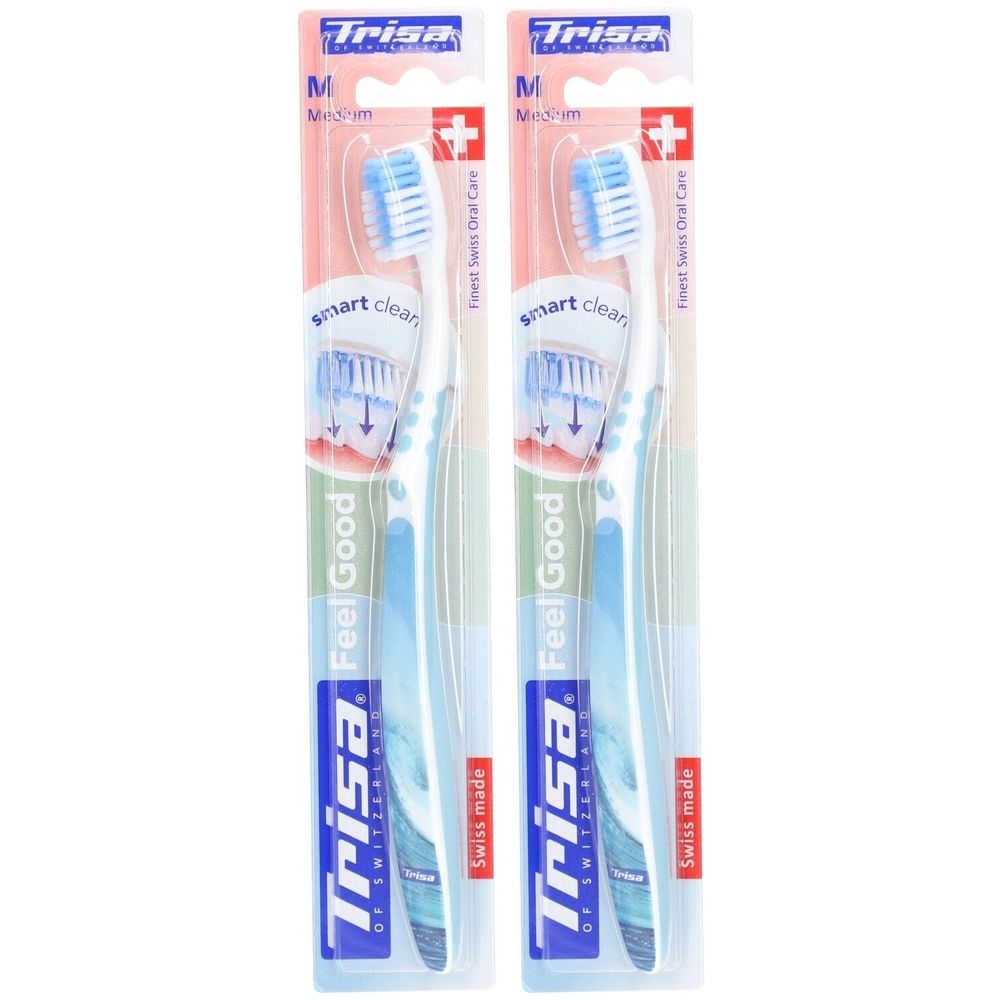 Deux brosses à dents emballées. Soies bleues, manche blanc. Marque: Trisa. Inscription: Feel Good, Swiss made.
