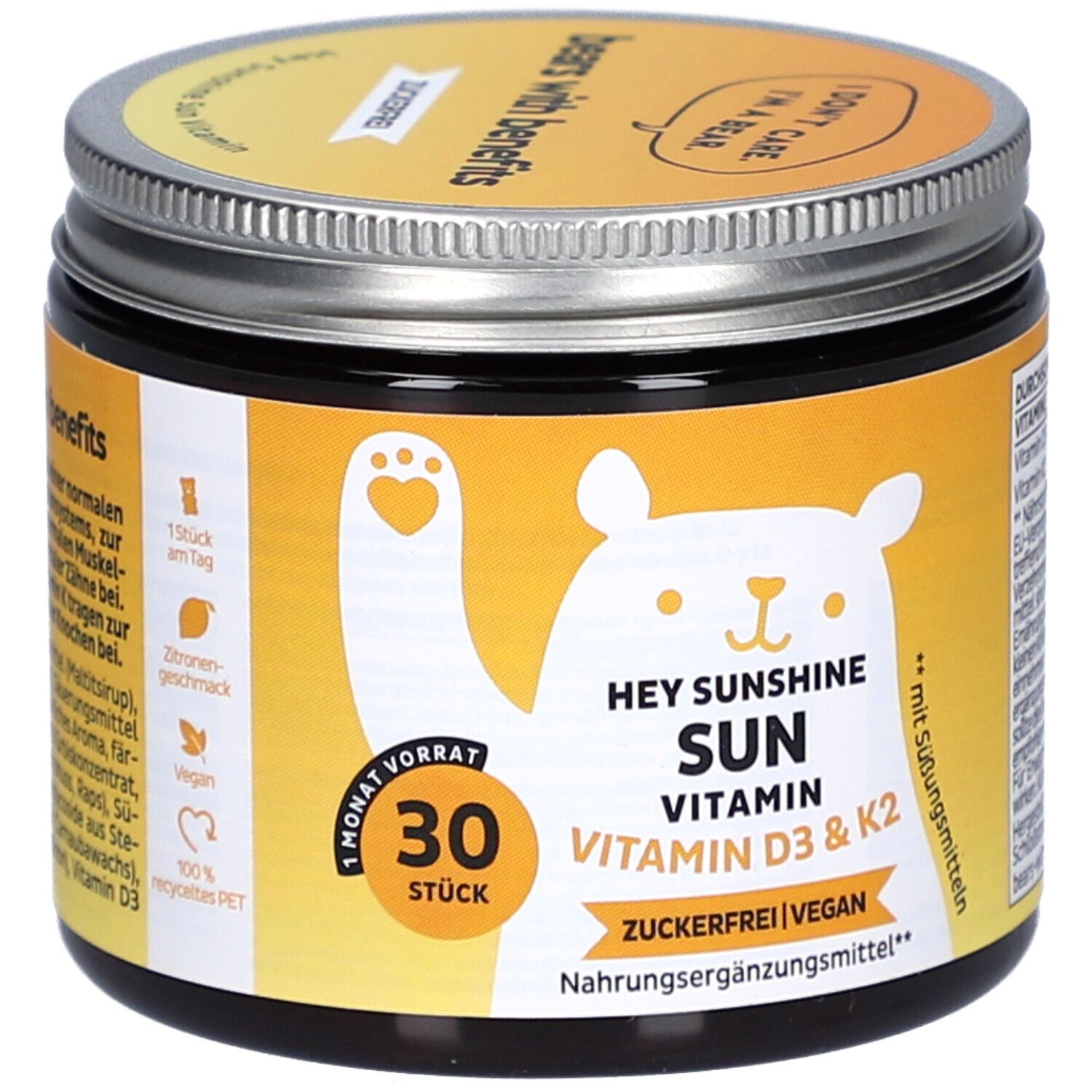 Pot avec couvercle. Inscription: HEY SUNSHINE SUN VITAMIN D3 & K2. 30 pièces. Sans sucre, végétalien. Étiquette jaune avec ours.