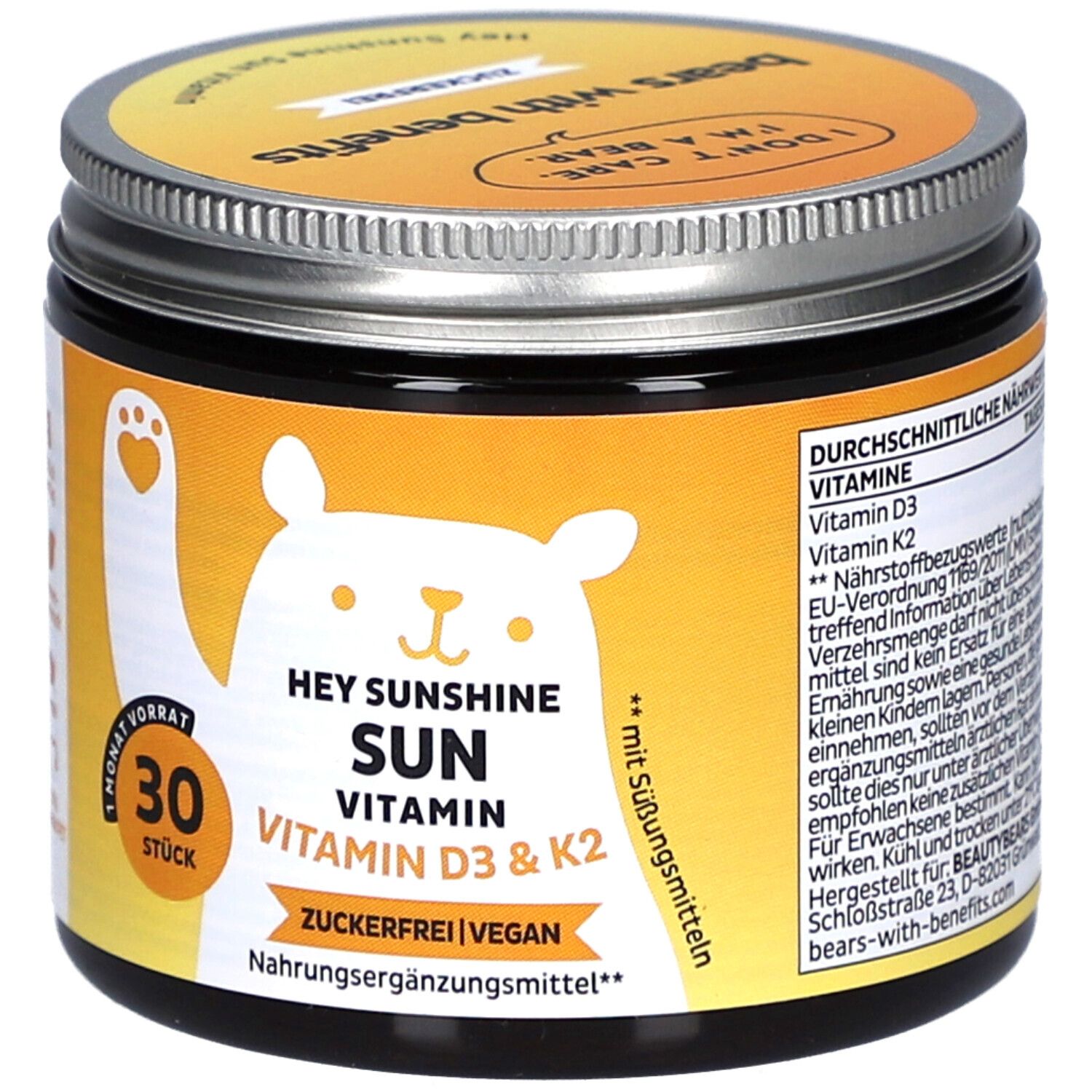 Pot avec couvercle. Inscription: HEY SUNSHINE SUN VITAMIN D3 & K2. 30 pièces. Sans sucre, végétalien. Étiquette jaune avec ours.