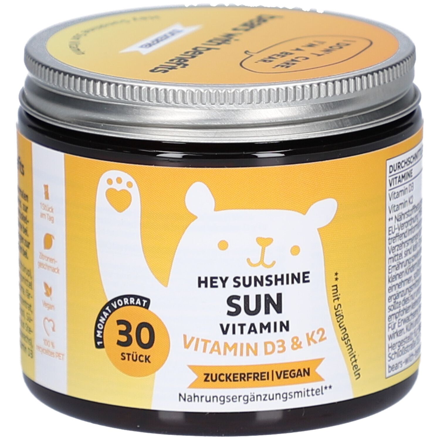 Pot avec couvercle. Inscription: HEY SUNSHINE SUN VITAMIN D3 & K2. 30 pièces. Sans sucre, végétalien. Étiquette jaune avec ours.