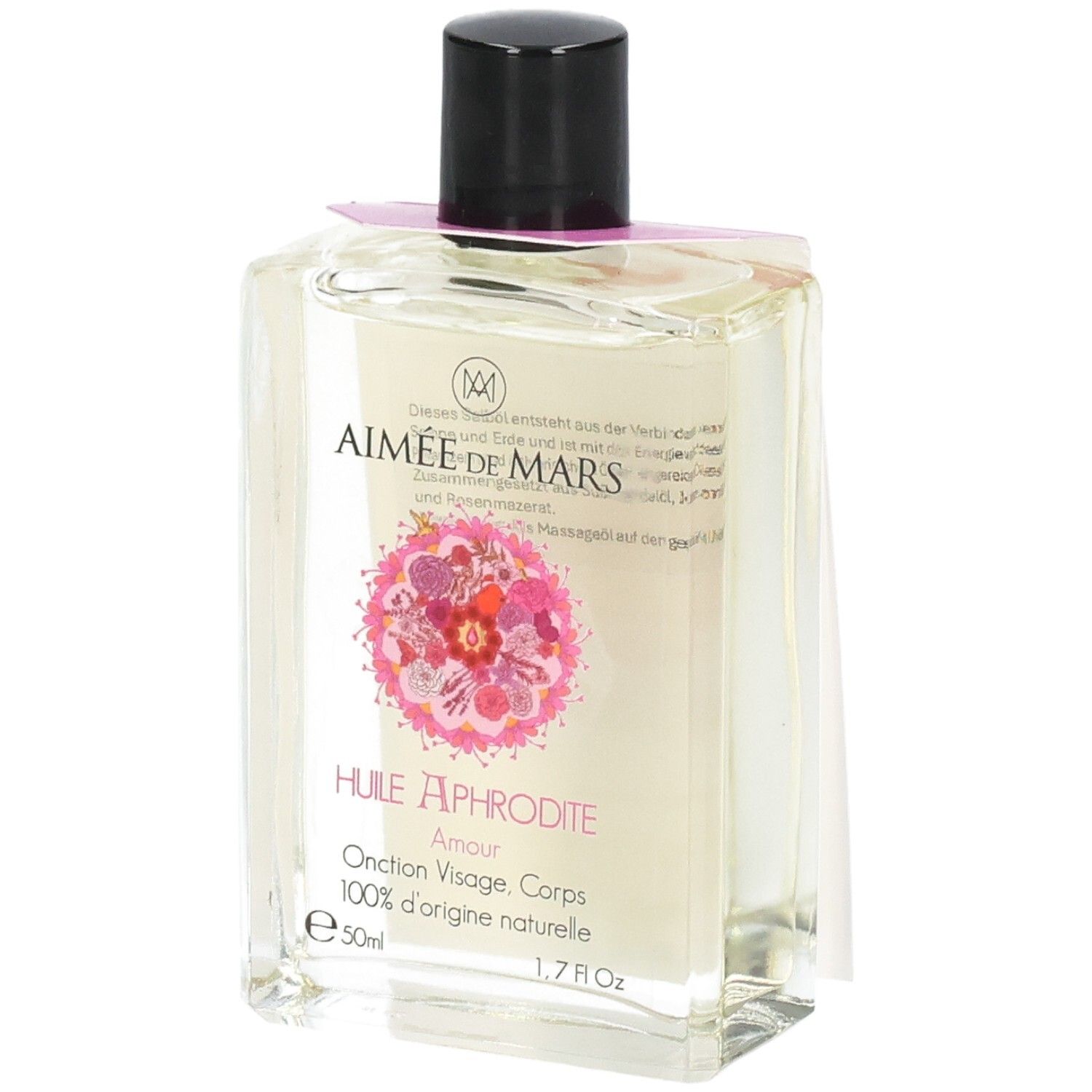 Huile claire en flacon rectangulaire en verre, bouchon noir. Étiquette rose avec motif floral et texte.