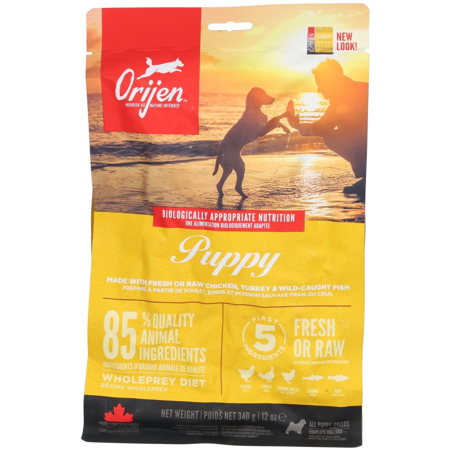 Sac jaune ORIJEN pour chiots. Illustration de chiot et humain. Texte: Puppy, 85% ingrédients animaux, 5 ingrédients frais/crus. Poids net: 340g.