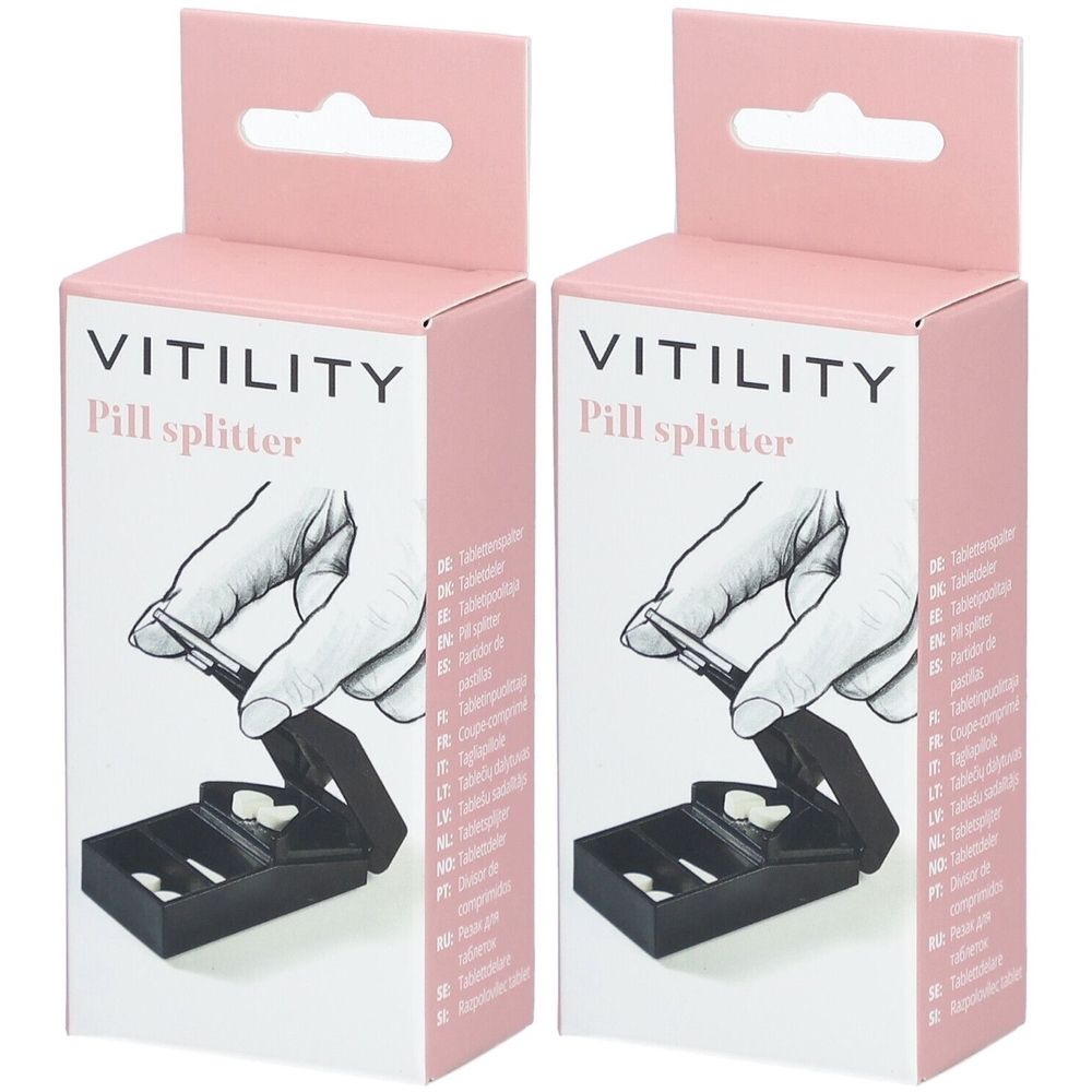 Deux boîtes de coupe-comprimés. Inscription : VITILITY Pill splitter. Emballage rose et blanc. Démonstration d'utilisation.