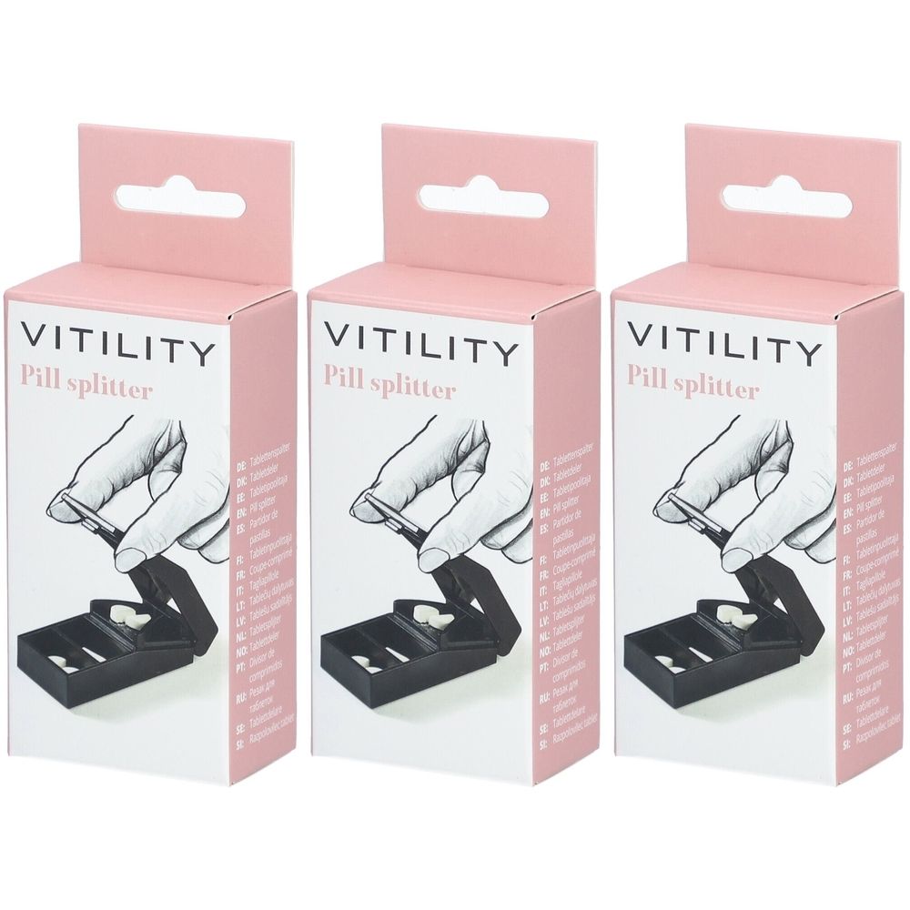 Trois boîtes de séparateur de pilules. Inscription VITILITY Pill splitter. Boîtes roses et blanches avec crochet.