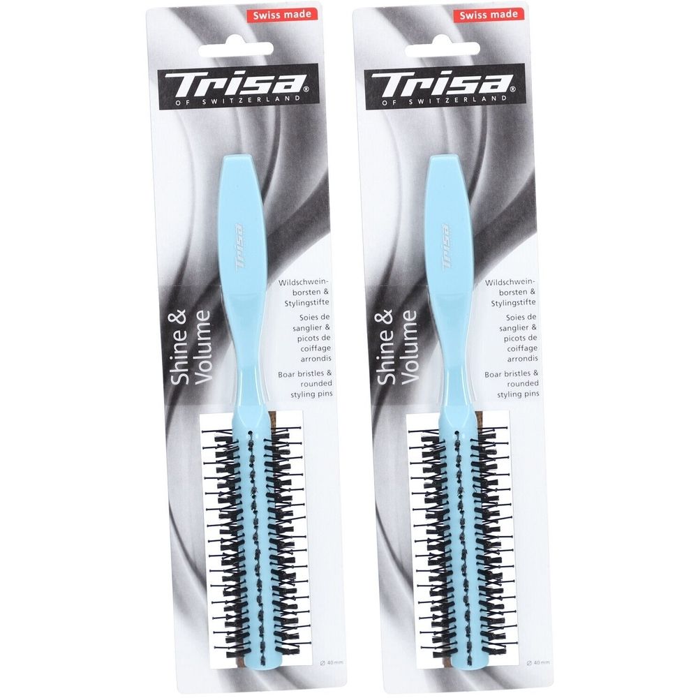 Deux brosses à coiffer avec manche bleu clair et tête à poils noirs. Emballées dans un blister blanc et bleu avec le nom de la marque.